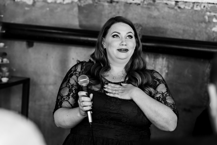 A bridesmaid starts to cry during her speech at the wedding reception.